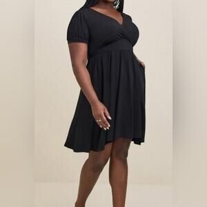 Woman’s Torrid Mini Studio Knit Surplice Black Dress size 4